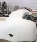 This Tuesday, Jan. 19, 2016 photo provided by the Ontario Provincial Police shows a snow covered vehicle in Brussels, Ontario. An 80-year-old man has been charged after driving the car that was almost completely covered in snow with only the driver’s side windshield visible. (Sgt. Russell Nesbitt/Ontario Provincial Police via AP)