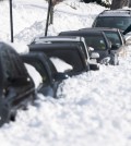 Ragi Puthur digs his car out from snow outside his home in Towson, Md., Monday, Jan. 25, 2016. East Coast residents continued to dig themselves out after a massive weekend snowstorm. (AP Photo/Steve Ruark)
