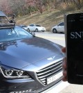 An IT research team at Seoul National University shows off "SNUber," an automated, driverless cab that can be hailed and maneuvered using a smartphone app, at university campus in Seoul on Nov. 4, 2015. The vehicle operates on a preloaded 3-D map, with cameras and sensors detecting surroundings up to 80 meters in front and back. (Yonhap)