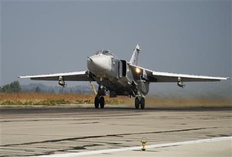 FILE - In this Oct. 22, 2015 file photo, a Russian Su-24 takes off on a combat mission at Hemeimeem airbase in Syria. Turkey said Saturday Jan. 30, 2016 that a Russian warplane SU-34 has again violated its airspace despite several warnings — two months after Turkey's military shot down a Russian jet for crossing over its territory. (AP Photo/Vladimir Isachenkov, File)