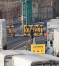 South Korean cargo trucks wait to head to the North Korean city of Kaesong as a South Korean Army patrols at the customs, immigration and quarantine office near the border village of Panmunjom in Paju, South Korea, Thursday, Feb. 11, 2016. South Korea said Wednesday that it will shut down a joint industrial park with North Korea in response to its recent rocket launch, accusing the North of using hard currency from the park to develop its nuclear and missile programs. (AP Photo/Ahn Young-joon)