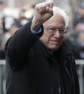 Democratic presidential candidate Sen. Bernie Sanders, I-Vt., raises a fist as he arrives for a breakfast meeting with Al Sharpton at Sylvia's Restaurant, Wednesday, Feb. 10, 2016, in the Harlem neighborhood of New York. Sanders defeated former Secretary of State Hillary Clinton on Tuesday in the New Hampshire primary. (AP Photo/Seth Wenig)