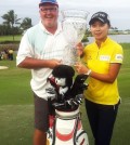 South Korean golfer Kim Hyo-joo (R) poses with her trophy after winning the 2016 LPGA Tour season opener in the Bahamas on Jan. 31, 2016 (local time). Kim, 20, won the Pure Silk Bahamas LPGA Classic at 18-under 274, her third LPGA victory. (Photo provided by Kim's management agency G-Ad Communications)