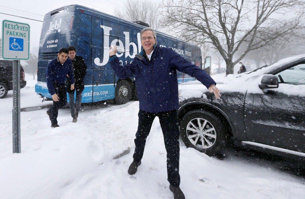 Republican presidential candidate, former Florida Gov. Jeb Bush throws a snowball following a campaign event, Monday, Feb. 8, 2016, in Nashua, N.H. (AP Photo/Steven Senne)