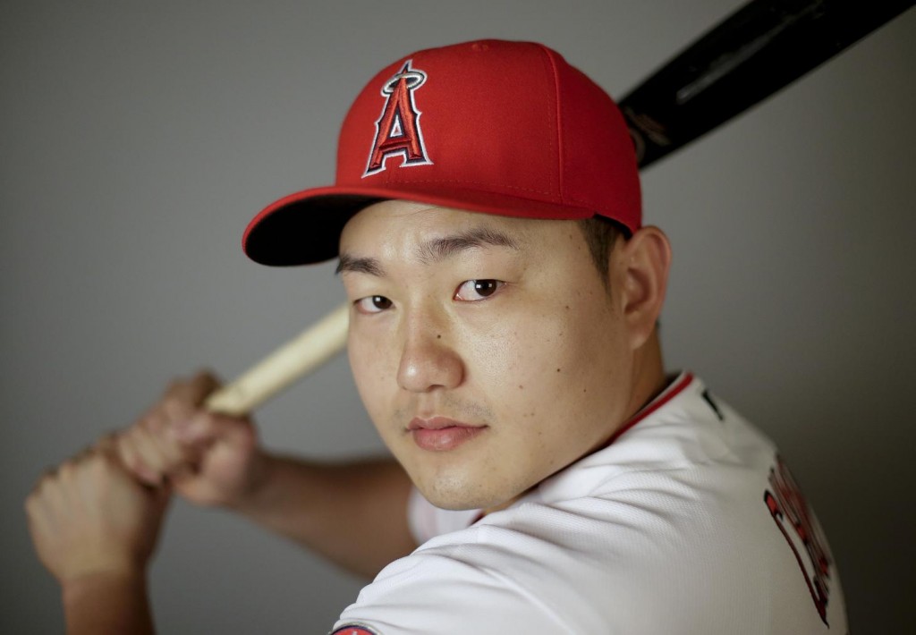 FILE - In this Feb. 26, 2016, file photo,  Ji-Man Choi of the Los Angeles Angels baseball team, poses in Tempe, Ariz. Ji-Man Choi didn't become a swtich-hitter until midway through last season. His remarkable mid-career adjustment could make him part of the Los Angeles Angels' patch for their hole in left field.  (AP Photo/Chris Carlson, File)