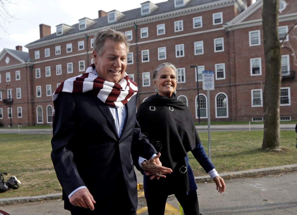 Actors Ryan O'Neal, left, and Ali MacGraw walk on the campus of Harvard University in Cambridge, Mass., Monday Feb. 1, 2016, more than 45 years after the release of their 1970 classic "Love Story." The duo, now in their 70s, currently are co-starring in a national tour of "Love Letters," which is about a man and a woman who maintain contact over 50 years through notes, cards and letters. (AP Photo/Elise Amendola)