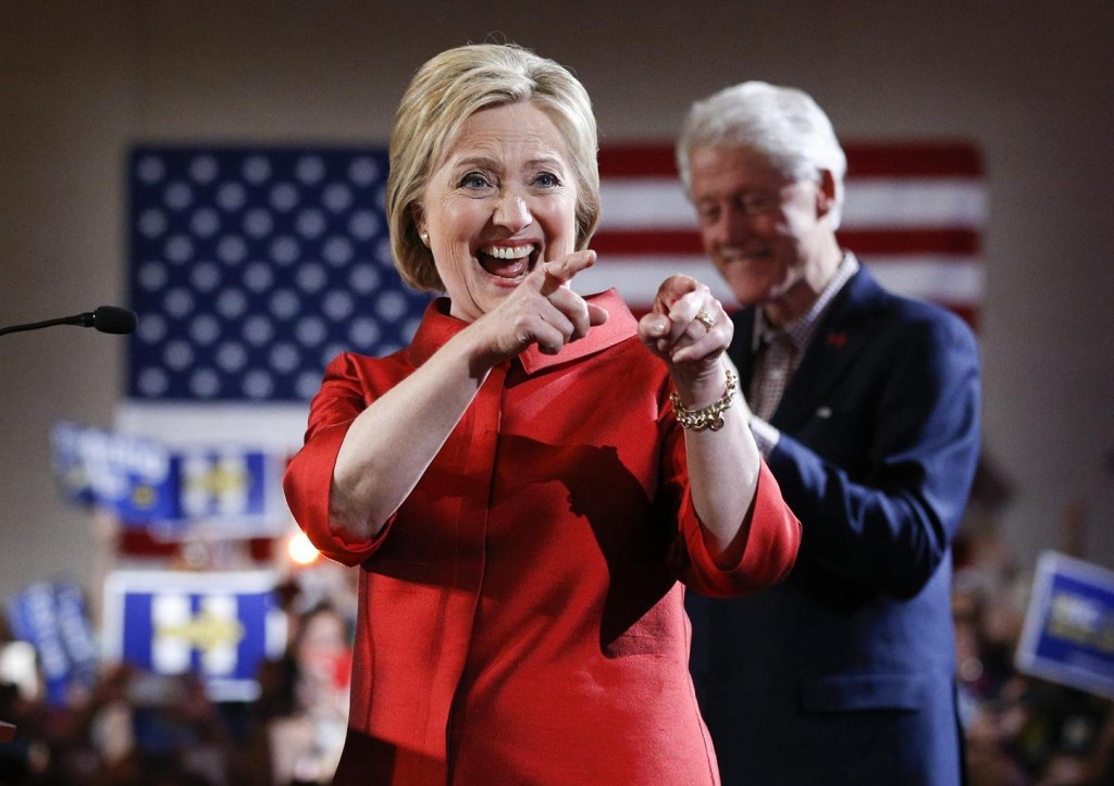 Democratic presidential candidate Hillary Clinton, left, greets supporters with her husband and former President Bill Clinton at a Nevada Democratic caucus rally, Saturday, Feb. 20, 2016, in Las Vegas. (AP Photo/John Locher)