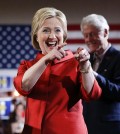 Democratic presidential candidate Hillary Clinton, left, greets supporters with her husband and former President Bill Clinton at a Nevada Democratic caucus rally, Saturday, Feb. 20, 2016, in Las Vegas. (AP Photo/John Locher)