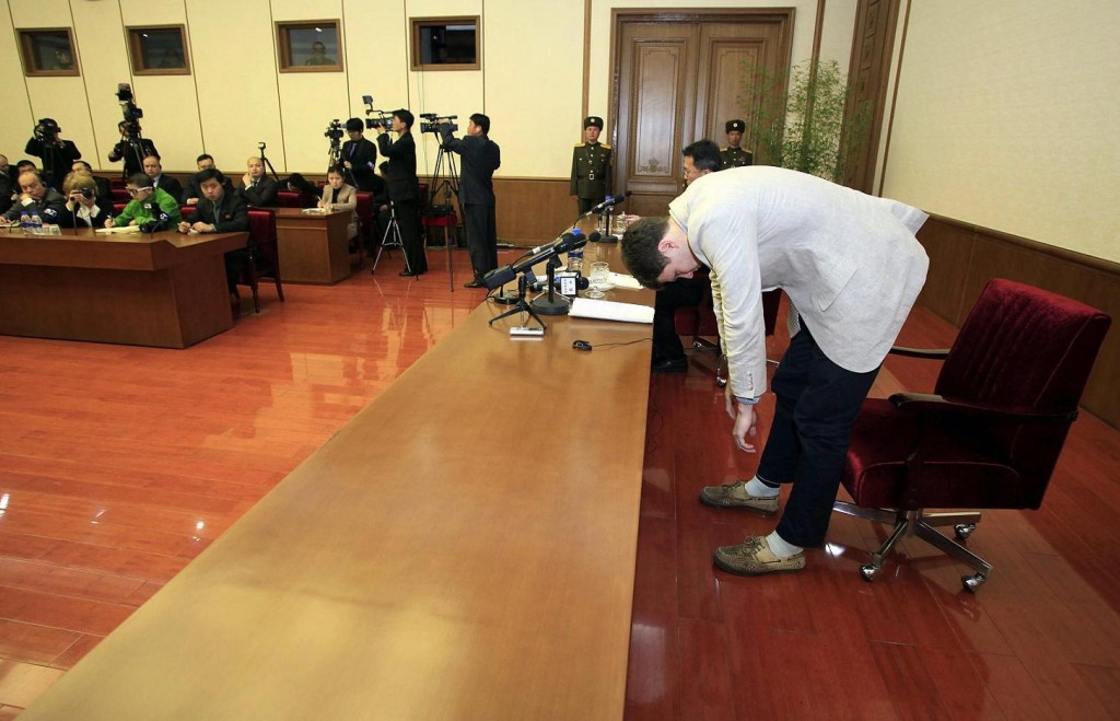 American student Otto Warmbier, right, bows as Warmbier is presented to the reporters on Monday, Feb. 29, 2016, in Pyongyang, North Korea. North Korea announced late last month that it had arrested the 21-year-old University of Virginia undergraduate student. (AP Photo/Kim Kwang Hyon)