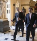 House Speaker Paul Ryan of Wis., center, walks to the House chamber on Capitol Hill in Washington, Friday, Feb. 12, 2016, as Republicans and Democrats joined together to overwhelmingly approve legislation that hits North Korea with more stringent sanctions for refusing to stop its nuclear weapons program. (AP Photo/J. Scott Applewhite)