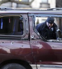 In this Jan. 19, 2016 photo, Chicago police investigate the scene where multiple people were shot on the city’s South Side. Chicago police said Monday, Feb. 1, 2016, the number of homicides in the city climbed dramatically in January to 51, in the bloodiest start to a year in at least 16 years. They said there were 22 more homicides this January than in January 2015 and that the number of shooting incidents during the same period more than doubled to 242. (Chris Sweda/Chicago Tribune via AP)