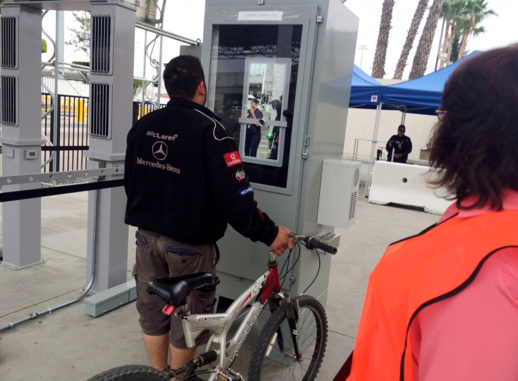 Ramon Rangel, 29, a Tijuana truck driver stands at a machine that captured images of his iris and facial features to verify his documents while leaving San Diego on his way to Mexico on Thursday, Feb. 18, 2016. The US government announced Thursday it was using eye scans and facial recognition technology on foreigners leaving the US on foot at a busy San Diego crossing with Mexico. (AP Photo/Julie Watson)