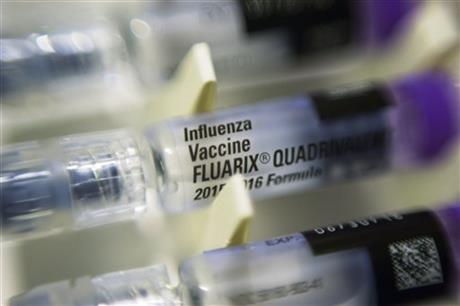 FILE - This Thursday, Nov. 12, 2015 file photo shows single dosage syringes of the Fluarix quadrivalent influenza virus vaccine in New York. According to numbers presented at a medical meeting in Atlanta on Wednesday, Feb. 24, 2016, the flu vaccine is doing a better job in 2016. (AP Photo/Patrick Sison)
