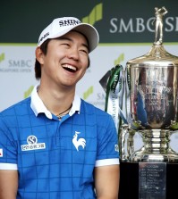 Song Younghan smiles during an interview after winning the SMBC Singapore Open golf tournament at Sentosa Golf Club's Serapong Course on Monday, Feb. 1, 2016, in Singapore. (AP Photo/Wong Maye-E)