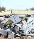 Parts of a crashed Army helicopter are scattered about a civilian farm in Chuncheon, Gangwon Province, on Feb. 15, 2016, during an inspection flight. Three of the four men aboard died while being treated at hospitals. The pilot, the lone survivor, is in critical condition. (Yonhap)