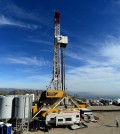 FILE - In this Dec. 9, 2015, pool file photo, crews work on stopping a gas leak at a relief well at the Aliso Canyon facility above the Porter Ranch area of Los Angeles.The utility says it has stopped the natural gas leak near Los Angeles after nearly 4 months. (Dean Musgrove/Los Angeles Daily News via AP, Pool, File)