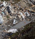 This aerial photo shows damage after a tornado ripped through the Sugar Hill Recreational Park in the town of Convent, in southern La., Wednesday, Feb. 24, 2016. Tornadoes ripped through the RV park in Louisiana and significantly damaged nearly 100 homes and apartments in Florida as a deadly storm system rolled across the South, and forecasters warned that more twisters were possible Wednesday along the East Coast. (David Grunfeld/NOLA.com The Times-Picayune via AP)