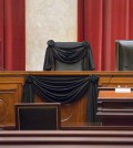 Supreme Court Justice Antonin Scalia’s courtroom chair is draped in black to mark his death as part of a tradition that dates to the 19th century, Tuesday, Feb. 16, 2016, at the Supreme Court in Washington. Scalia died Saturday at age 79. He joined the court in 1986 and was its longest-serving justice. (AP Photo/J. Scott Applewhite)