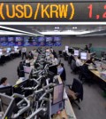 Foreign exchange dealers watch monitors at KEB Hana Bank in Seoul, Friday, when the won extended its decline to close at 1,234.4 won against the U.S. dollar, the lowest level since June 11, 2010. The Bank of Korea said Friday it will take every measure to prevent the won from fluctuating further against the dollar. (Korea Times photo by Seo Jae-hoon)