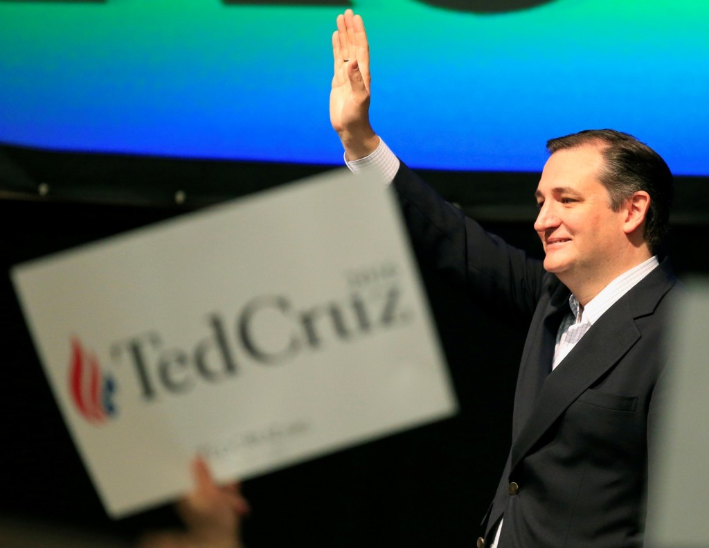 Republican presidential candidate, Sen. Ted Cruz, R-Texas waves to the crowd at the GOP caucus in Wichita, Kan., Saturday, March 5, 2016. (AP Photo/Orlin Wagner)