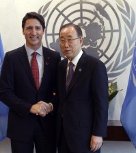 Canadian Prime Minister Justin Trudeau, left, shakes hands with United Nations General Secretary Ban Ki-moon at the United Nations headquarters  Wednesday March 16, 2016. (Adrian Wyld /The Canadian Press via AP)