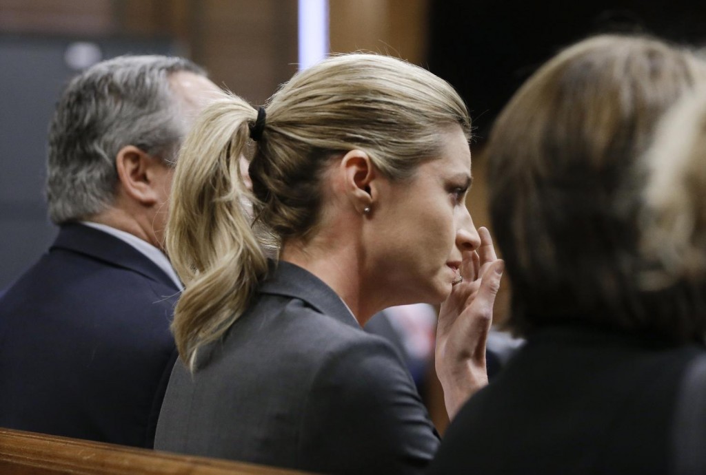 Sportscaster and television host Erin Andrews wipes tears as the verdict is read Monday, March 7, 2016, in Nashville, Tenn. A jury has awarded Andrews $55 million in her lawsuit against a stalker who bought a hotel room next to her and secretly recorded a nude video, finding that the hotel companies and the stalker shared in the blame. (AP Photo/Mark Humphrey, Pool)