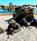 FILE - In this March 12, 2016 file photo, U.S. Marines, left, and South Korean Marines, wearing blue headbands on their helmets, take positions after landing on the beach during the joint military combined amphibious exercise, called Ssangyong, part of the Key Resolve and Foal Eagle military exercises, in Pohang, South Korea. It’s a demand North Korea has been making for decades: The U.S. and South Korea must immediately suspend their annual military exercises if they want peace on the Korean Peninsula. And, once again, it’s a demand that is falling on deaf ears. This year’s exercises are bigger than ever before and reportedly include training to take out Kim Jong Un himself. For Pyongyang’s ruling regime, that’s a bridge too far. But probably not far enough to fire the first shots over. (Kim Jun-bum/Yonhap via AP, File)