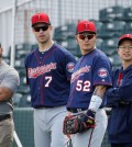 Minnesota Twins first baseman Joe Mauer (7) stands with teammate Byung Ho Park, of South Korea, during a spring training baseball workout in Fort Myers, Fla., Monday, Feb. 29, 2016. (AP Photo/Patrick Semansky)