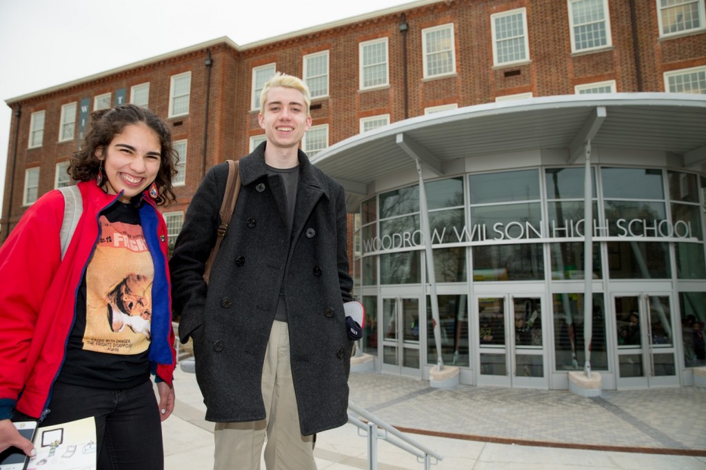 High School juniors Brian Keyes and Isabel Suarez, both 16, pose for a photograph in front of Woodrow Wilson High School in Washington, Thursday, March 3, 2016, after recently taking the new SAT exam. The new exam focuses less on arcane vocabulary words and more on real-world learning and analysis by students. Students no longer will be penalized for guessing. And the essay has been made optional. (AP Photo/Andrew Harnik)