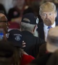 Republican presidential candidate Donald Trump reacts as veteran Keith Moppin asks the candidate to clarify comments he made about Arizona Sen. John McCain during a campaign stop at the Savannah Center, Sunday, March 13, 2016, in West Chester, Ohio. Trump said in July while campaigning in Iowa that he dismissed the notion that McCain, the 2008 Republican nominee for president, was a hero "Because he was captured." Trump said, "I like people who weren't captured." (AP Photo/John Minchillo)