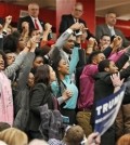 FILE -- Protesters yell as they are escorted out of a rally for Republican presidential candidate, Donald Trump at Radford University in Radford, Va., Monday, Feb. 29, 2016. (AP Photo/Steve Helber)