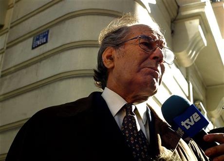 FILE - In this Feb. 21, 2005, file photo, Nobel Peace Prize winner Adolfo Perez Esquivel answers a journalist's questions at the Spanish National Court in Madrid, Spain, where he testified in a trial against an ex-Argentine navy officer Alfredo Scillingo accused of genocide committed in his country's dirty war more than two decades ago. Perez Esquivel said on Wednesday, March 2, 2016, that President Barack Obama should skip his planned March 24 visit to the country because it's the 40th anniversary of a coup that installed a military government that had U.S. backing. (AP/Mariana Eliano, File)