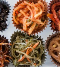 Shown is the Foodshop’s sampler box, with the banchan arranged in cupcake liners. (Cecilia Hae-Jin Lee / For the Los Angeles Times)