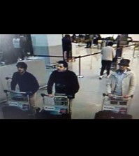 In this image provided by the Belgian Federal Police in Brussels on Tuesday, March 22, 2016 of three men who are suspected of taking part in the attacks at Belgium's Zaventem Airport. The man at right is still being sought by the police and two others in the photo that the police issued were according to a the Belgian Prosecutors 'probably' suicide bombers. Bombs exploded at the Brussels airport and one of the city's metro stations Tuesday, killing and wounding scores of people, as a European capital was again locked down amid heightened security threats. (Belgian Federal Police via AP)