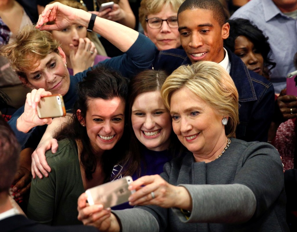 Democratic presidential candidate Hillary Clinton takes photos with supporters after speaking at a campaign rally in Norfolk, Va., Monday, Feb. 29, 2016. (AP Photo/Gerald Herbert) 