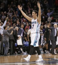 Charlotte Hornets' Jeremy Lin celebrates after an NBA basketball game against the San Antonio Spurs in Charlotte, N.C., Monday, March 21, 2016. The Hornets won 91-88. (AP Photo/Chuck Burton)