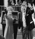 FILE - In this Jan. 20, 1981, file photo, President Ronald Reagan and first lady Nancy Reagan wave to onlookers at the Capitol building as they stand at the podium in Washington following the swearing in ceremony. The former first lady has died at 94, The Associated Press confirmed Sunday, March 6, 2016. (AP Photo/File)