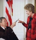 FILE - In this Nov. 18, 1988 file photo, former President Ronald Reagan hands a pen to then first lady Nancy Reagan after he signed a major anti-drug bill at a White House East Room ceremony in Washington. Reagan dedicated the bill to Nancy, who has led a "Just Say No" campaign among America's youth, and gave her the pen he used to sign the bill with. Nancy Reagan, who died Sunday, March 6, 2016, is perhaps best known for her "Just Say No" to drugs and alcohol campaign. Three decades after the campaign's heyday, prevention experts credit it with spawning a new generation of research into the best ways of reducing drug abuse. But they also say that many of the fear-based tactics it embraced didn't work.  (AP Photo/Ron Edmonds, File)