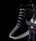 An image of the Nike HyperAdapt 1.0 is projected on a screen as Nike CEO Mark Parker speaks during a news conference, Wednesday, March 16, 2016, in New York. (AP Photo/Mary Altaffer)