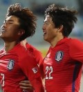 South Korean Olympic football team midfielder Moon Chang-jin (L) celebrates with teammate Kwon Chang-hoon after scoring a goal against Algeria during their friendly match at Icheon Sports Complex in Icheon, Gyeonggi Province, on March 25, 2016. (Yonhap