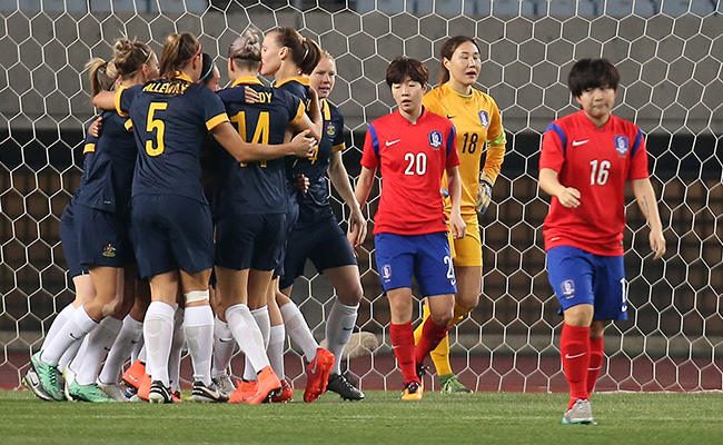 Members of the Australian football team celebrate after scoring their first goal in the 56th second against South Korea during the Asian women's Olympic football qualifying match at Yanmar Stadium Nagai in Osaka, Japan, Friday. (Yonhap)