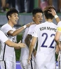South Korean men's football team players celebrate after scoring a goal against Thailand during their friendly match at Suphachalasai Stadium in Bangkok on March 27, 2016. (Yonhap)
