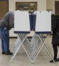 Voters fill out their ballots during the primary election Tuesday, March 8, 2016 at the Fort Gratiot Township Hall in Fort Gratiot, Mich. Presidential candidates in both parties were looking to Michigan on Tuesday for one of the largest delegate hauls in the bruising nominating contests. (Jeffrey M. Smith/The Times Herald via AP)