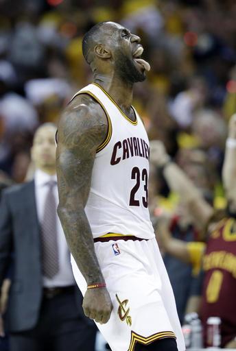 Cleveland Cavaliers' LeBron James (23) reacts during the first half against the Toronto Raptors in Game 1 of the NBA basketball Eastern Conference finals, Tuesday, May 17, 2016, in Cleveland. (AP Photo/Tony Dejak)