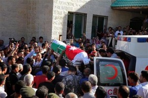 Jordanian soldiers and relatives of Jordanian soldier Belal Al-Zuhbi carry his coffin near the city of Jerash, north of Amman, Jordan, Tuesday, June 21, 2016. A suicide attacker driving a truck packed with explosives barreled through Syria's border with Jordan, setting off a blast that killed six members of the Jordanian security forces and wounded 14. A government spokesman says Jordan is sealing the border area, leaving it unclear how international aid will reach some 64,000 Syrian refugees stranded on the other side. It was the deadliest attack along the tense border in recent memory.