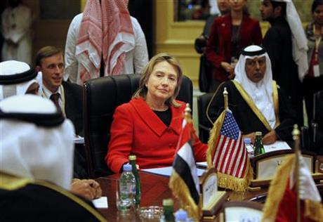 In this Wednesday, January 12, 2011 file photo, Then U.S. Secretary of State Hillary Rodham Clinton, center, talks to Gulf Cooperation Council Foreign Ministers during a meeting in Doha, Qatar. Stepping up to a microphone on the campaign trail this week, presumptive U.S. Democratic presidential candidate Hillary Clinton was unsparing when she talked about America’s allies in the Persian Gulf.