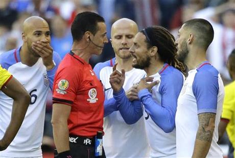 United States midfielder Jermaine Jones, second from right, protests to referee Wilmar Roldan, second from left, after Roldan gave Jones a red card in the second half of a Copa America Centenario soccer match against Ecuador, Thursday, June 16, 2016 at CenturyLink Field in Seattle. The United States beat Ecuador 2-1.
