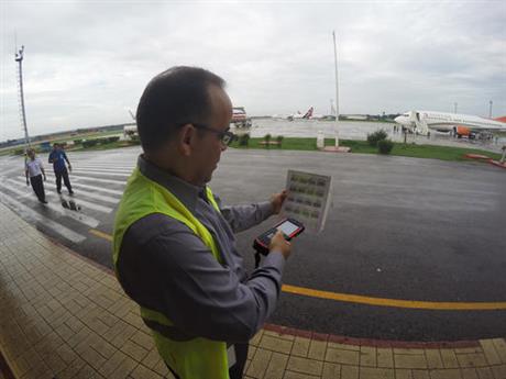 In this Thursday, June 9, 2016, photo, Galo Beltran, Cuba country manager for American Airlines, tests a handheld baggage scanner at Havana’s Jose Marti International Airport. Beltran is based in Dallas. The Department of Transportation said Friday that six airlines: American, Frontier, JetBlue, Silver Airways, Southwest and Sun Country, have been selected for routes to nine Cuban cities other than Havana.