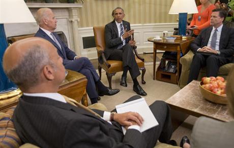 President Barack Obama, center, speaks to members of the media in the Oval Office of the White House in Washington, Monday, June 13, 2016, after getting briefed on the investigation of a shooting at a nightclub in Orlando by FBI Director James Comey, right, Homeland Security Secretary Jeh Johnson, left, and Vice President Joe Biden.