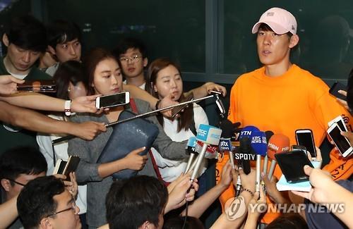 South Korean swimmer Park Tae-hwan answers a reporter's question at Incheon International Airport on July 14, 2016.